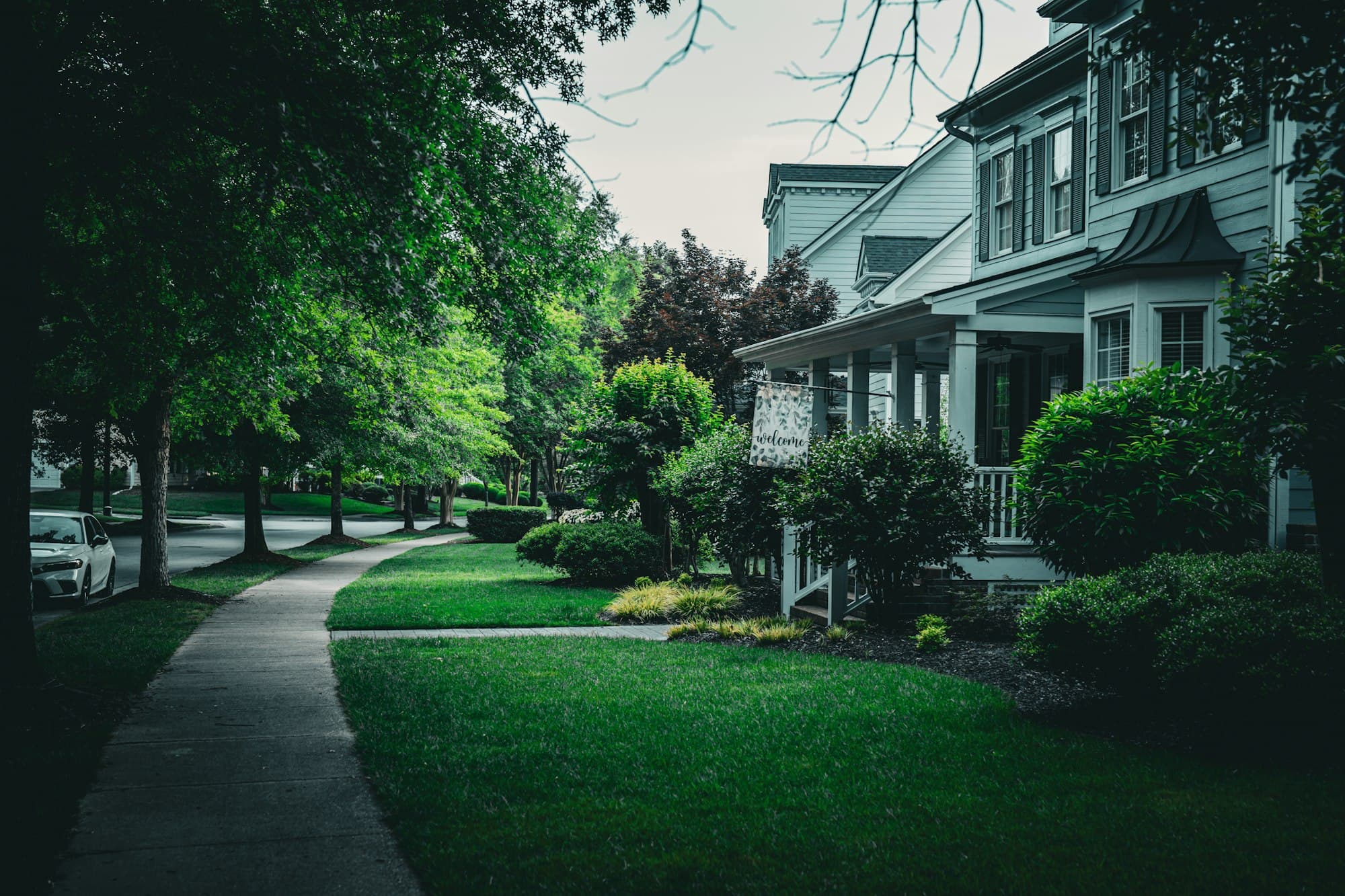 Suburban home with a green lawn and sidewalk in the Bedford neighborhood of Raleigh, North Carolina